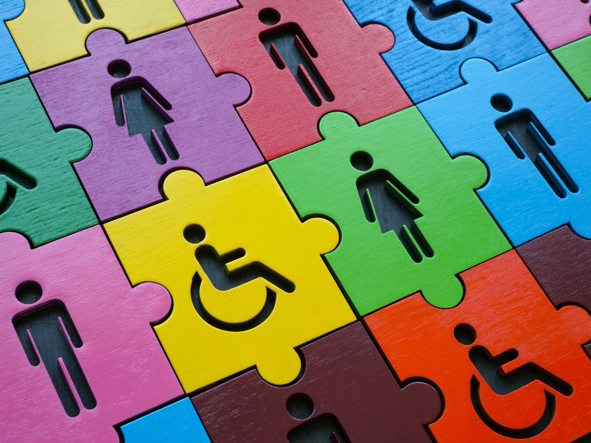 Diversity and inclusion. Multi-colored puzzle with figures of people.